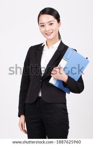A business woman holding a blue folder high quality photo