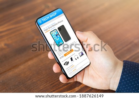 Man shopping for mobile phone in online tech store