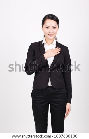 A young business woman in a suit high quality photo 