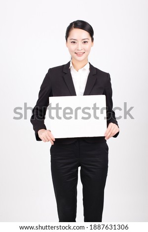 A business woman holding a white board high quality photo