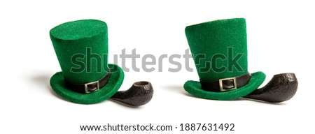 green classic leprechaun hat smoking pipe isolated on white background