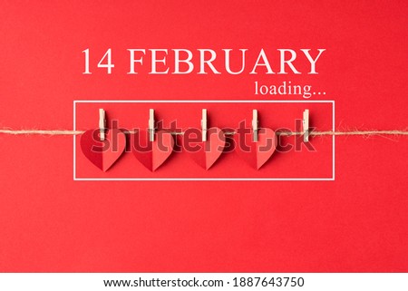 Valentines day is coming concept. Flat lay close up view photo of little red bright color hearts hanging on rope with inscription isolated vivid backdrop