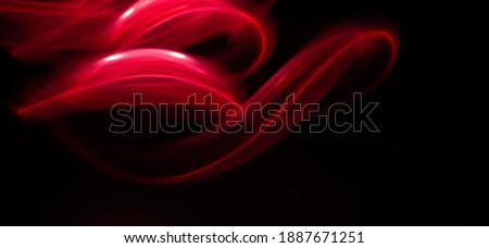 Red Neon light pattern using Light painting technique in a Black Veil