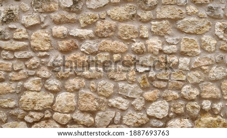 Texture of a rustic stone wall Royalty-Free Stock Photo #1887693763