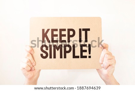 Closeup Business man hand holding show blank paper sheet mock up empty white board space for shouting text rule or protest word. Text KEEP IT SIMPLE