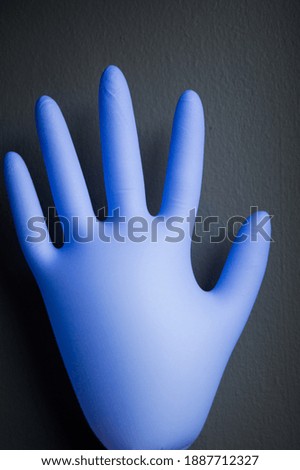 Inflated and filled with air rubber glove