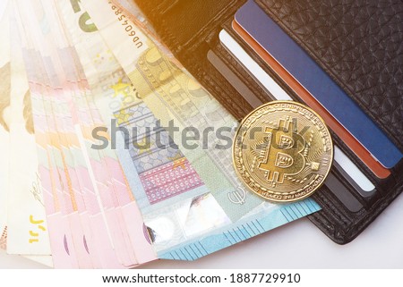 Top view digital cryptocurrency, gold bitcoin, electronic computer component and money bills with wallet and credit cards. Virtual money business concept. close up