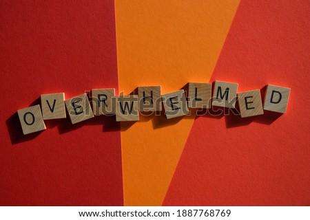 Overwhelmed, word in wooden alphabet letters isolated on orange and red background with copy space Royalty-Free Stock Photo #1887768769