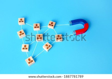 The magnet interacts with the company's network of people. Attracting new customers based on recommendations and good reviews. Business team building. Recruitment of entire formed teams of employees. Royalty-Free Stock Photo #1887781789