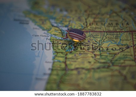 Seattle pinned on a map with USA flag
