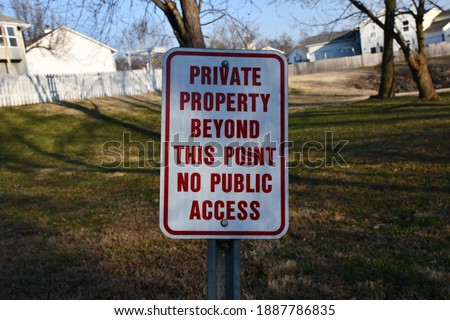 A sign in front of a neighborhood that reads: “Private property beyond this point no public access.” Picture taken near the Rabbit Run Trail in St. Peters, Missouri.