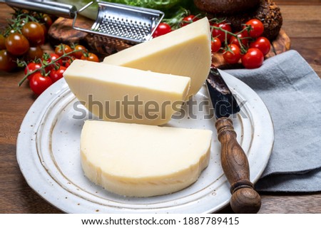 Cheese collection, Italian pasta filata aged cheese provolone from Cremona, Northwest of Italy, close up Royalty-Free Stock Photo #1887789415