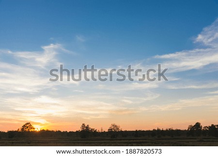 Countryside scenery under the beautiful colorful sky at sunset, warm color