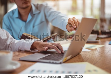 Businessman discussing new project or online data,Strategy Department in corporate brainstorming at meeting room.Business  meeting concept.  Royalty-Free Stock Photo #1887837130