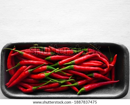 A pile of red chilli peppers. isolated on white background. 