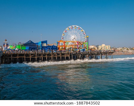 Wide view of Santa Monica pier Ferris Wheel in California.