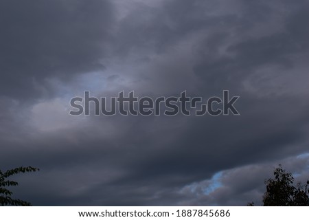 picture of thunderstorm clouds starting to pour rain and lightning.