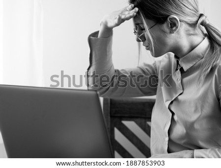 Happy Young Beautiful Woman Using Laptop, Indoors. Working. Woman laptop. Black and white photo. 
