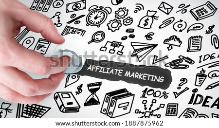 Technology, Internet and network concept. Young businessman shows the word: Affiliate marketing 
