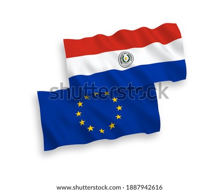 National vector fabric wave flags of European Union and Paraguay isolated on white background. 1 to 2 proportion.