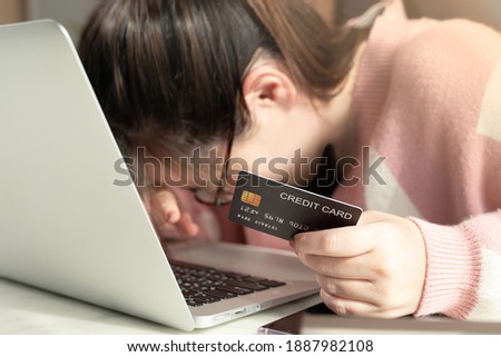 Covid-19 pandemic lockdown causing financial stress concept. A beautiful woman can not use her credit card anymore as she has spend full credit limit. Overwhelmed, Crisis, Debt, Late payment, Problem. Royalty-Free Stock Photo #1887982108