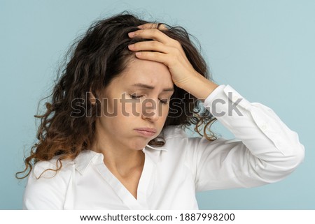 Studio portrait of tired frustrated business woman or office worker sighing and wiping sweat of forehead, has emotional burnout, exhausted by long work during hot weather in the office, isolated. Royalty-Free Stock Photo #1887998200