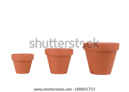 Three terracotta planters of different sizes on white. Royalty-Free Stock Photo #188801753