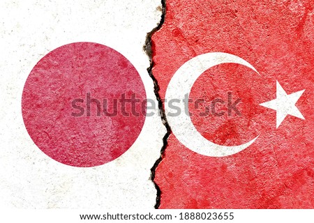 Faded Japan VS Turkey national flags icon isolated on broken weathered cracked concrete wall background, abstract international political relationship conflicts concept texture background wallpaper