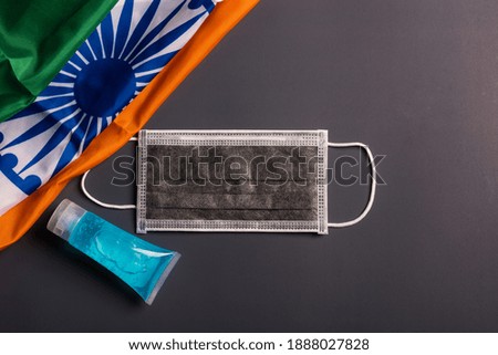 Medical protective disposable face mask for cover mouth with India flag, studio shot on gray background, Safety healthcare medical prevent coronavirus or Covid-19