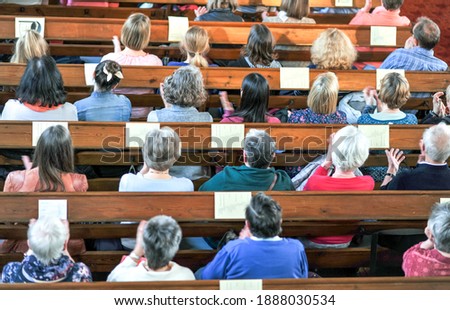 Top view on a Christian community at a church service or concert in a church - selective focus, blurred motion (hands)  Royalty-Free Stock Photo #1888030534
