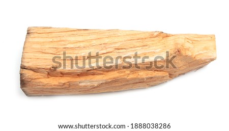 Close up of a wooden block isolated on a white background.