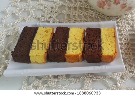 Kue bolu lapis or chocolate layer spongecake. Selective focus.
