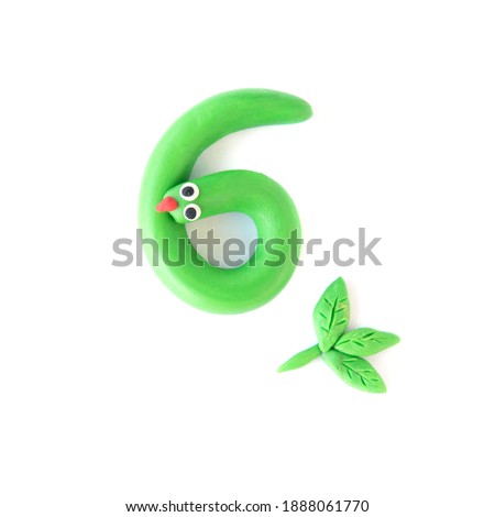 Number 6 made from colorful plasticine isolated on white background. Learning numbers with child.