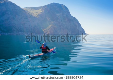 Kayak. People kayaking in the sea. Leisure activities on the calm blue water. Royalty-Free Stock Photo #188806724