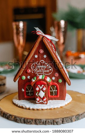 Gingerbread house with lights inside, dark background
