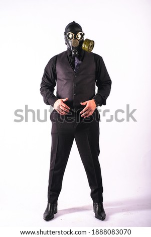 cosplay of a guy in a gas mask on a white background with glowing eyes
