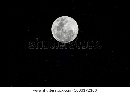 Full moon with real stars in the dark night.