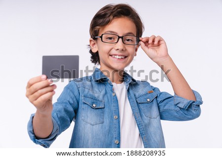 Clever 10s white boy with credit card isolated over white background