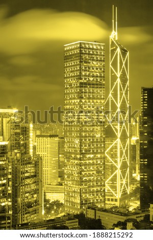 Hong Kong downtown with skyscrapers at night. Trendy colors of 2021 - Ultimate Gray and Illuminating