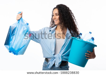 Happy Lady Sorting Waste Holding Plastic Garbage Bag And Bucket Posing Over White Background In Studio. Used Litter Trash Disposal And Recycling, Keep Environment Clean Concept