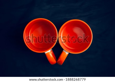 ceramic mugs dark orange on a dark background