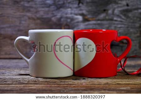 Two cups symbolizing love. Valentine's Day,  romantic symbol of love. Selective focus, blurred backgrounds