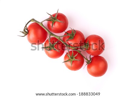 Red tomatoes on a vine isolated on a white background. Royalty-Free Stock Photo #188833049
