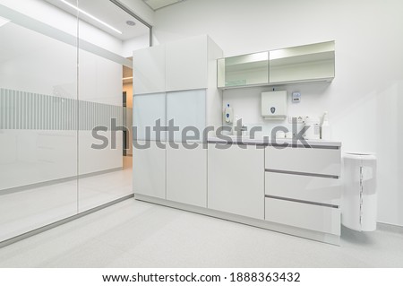 White furniture in modern dentistry medical room with special equipment Royalty-Free Stock Photo #1888363432