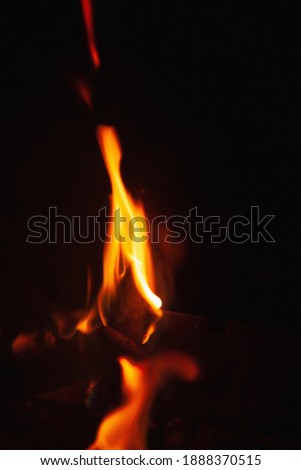 Beautiful pictures of fire flame against black background as symbol of hell and eternal pain in Christian tradition.