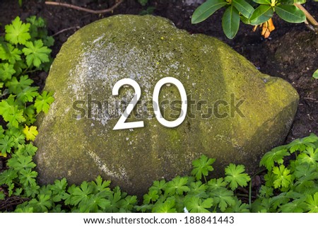 stone with house number 