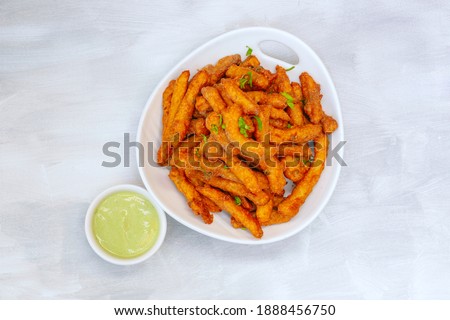 Masala fries with mint chutney Royalty-Free Stock Photo #1888456750