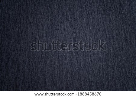 Stone black texture background. Dark cement.Black wallpaper.