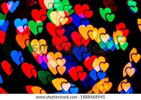Colorful abstract heart bokeh background lights. Valentines day texture pattern. Romantic background.
