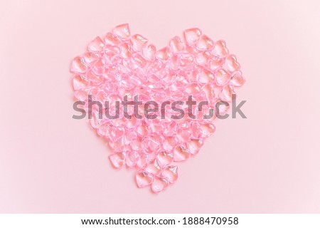 St. Valentine's Day concept. Heart shaped objects many pink hearts isolated on pink pastel background. Postcard banner on valentines day. Love date lovesick wedding romance symbol. Top view flat lay
